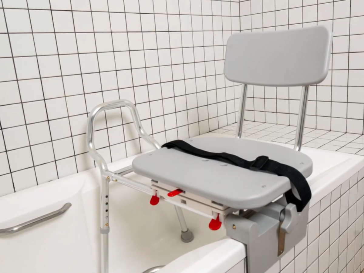 Compact tub-mount transfer bench installed on bathtub wall for space-saving support